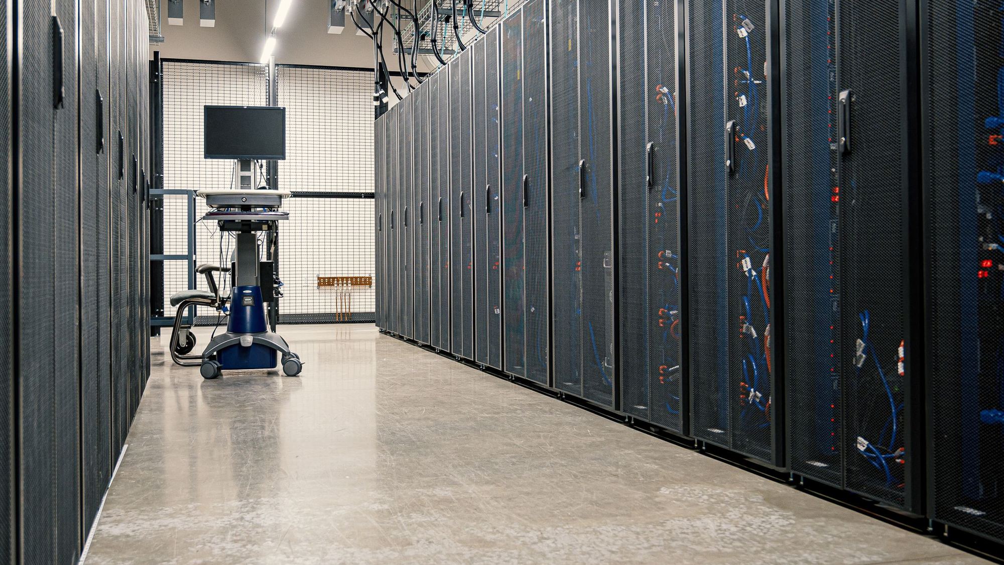 Data center aisle lined with server racks